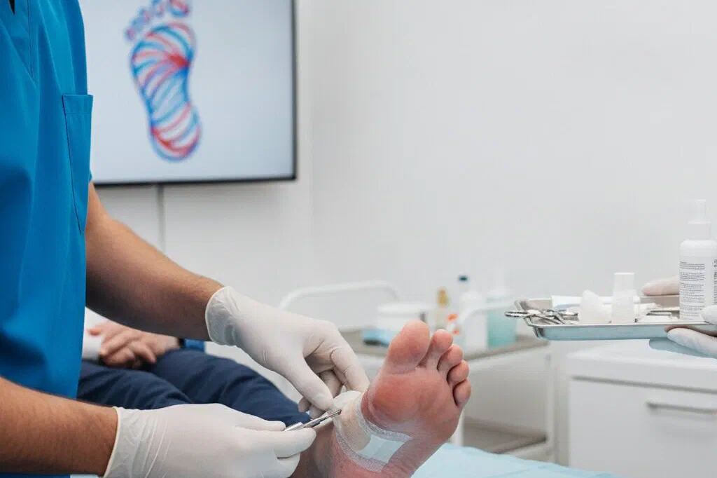 An examination with a foot image shown on a screen